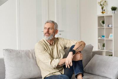 A man sat on his sofa