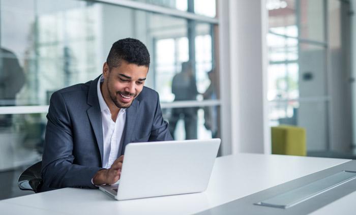 A businessman working on a laptop